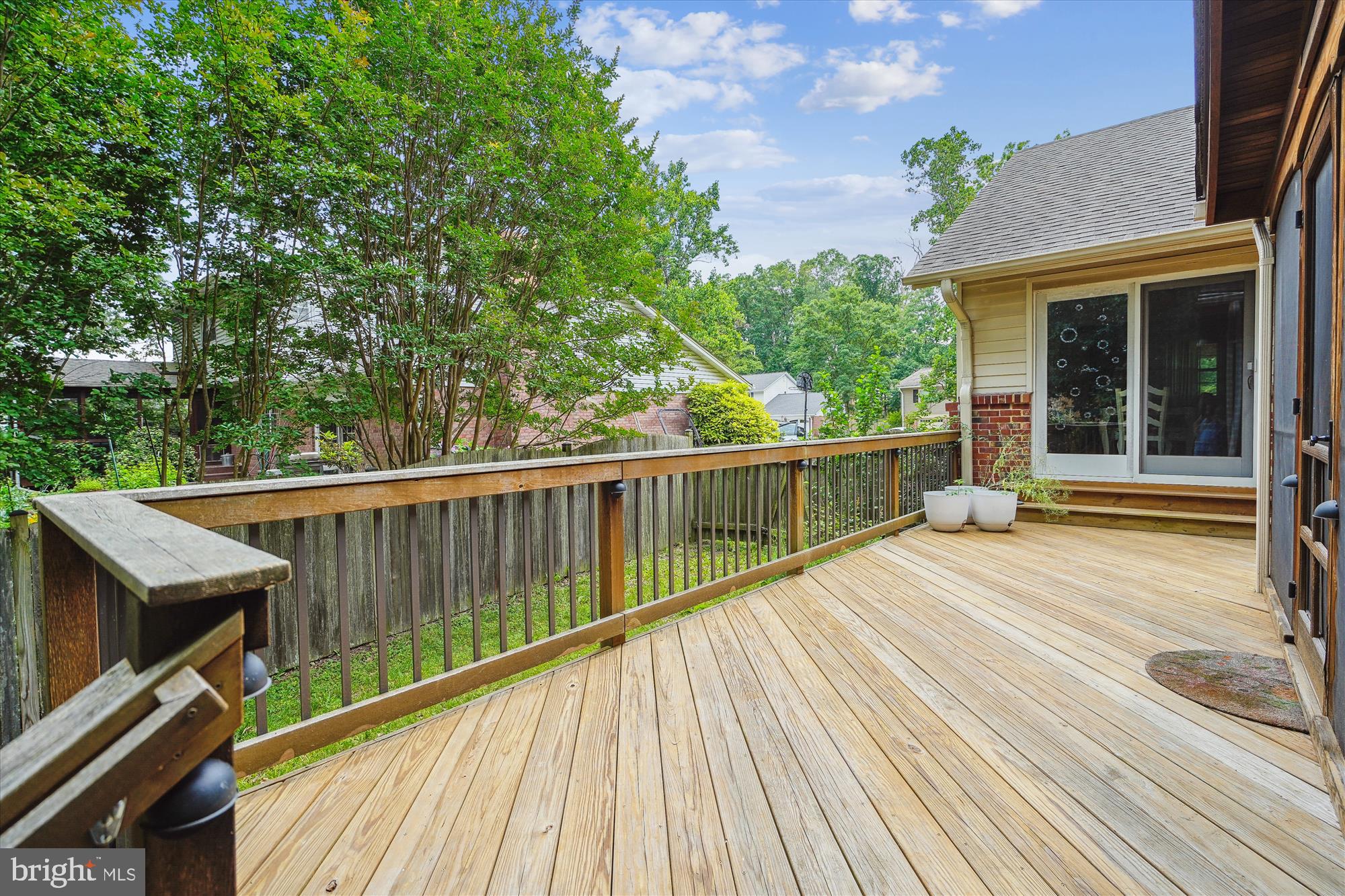8510 Oakford Drive Springfield, VA 22152 - Photo 7 of 36 a view of a wooden deck with a yard
