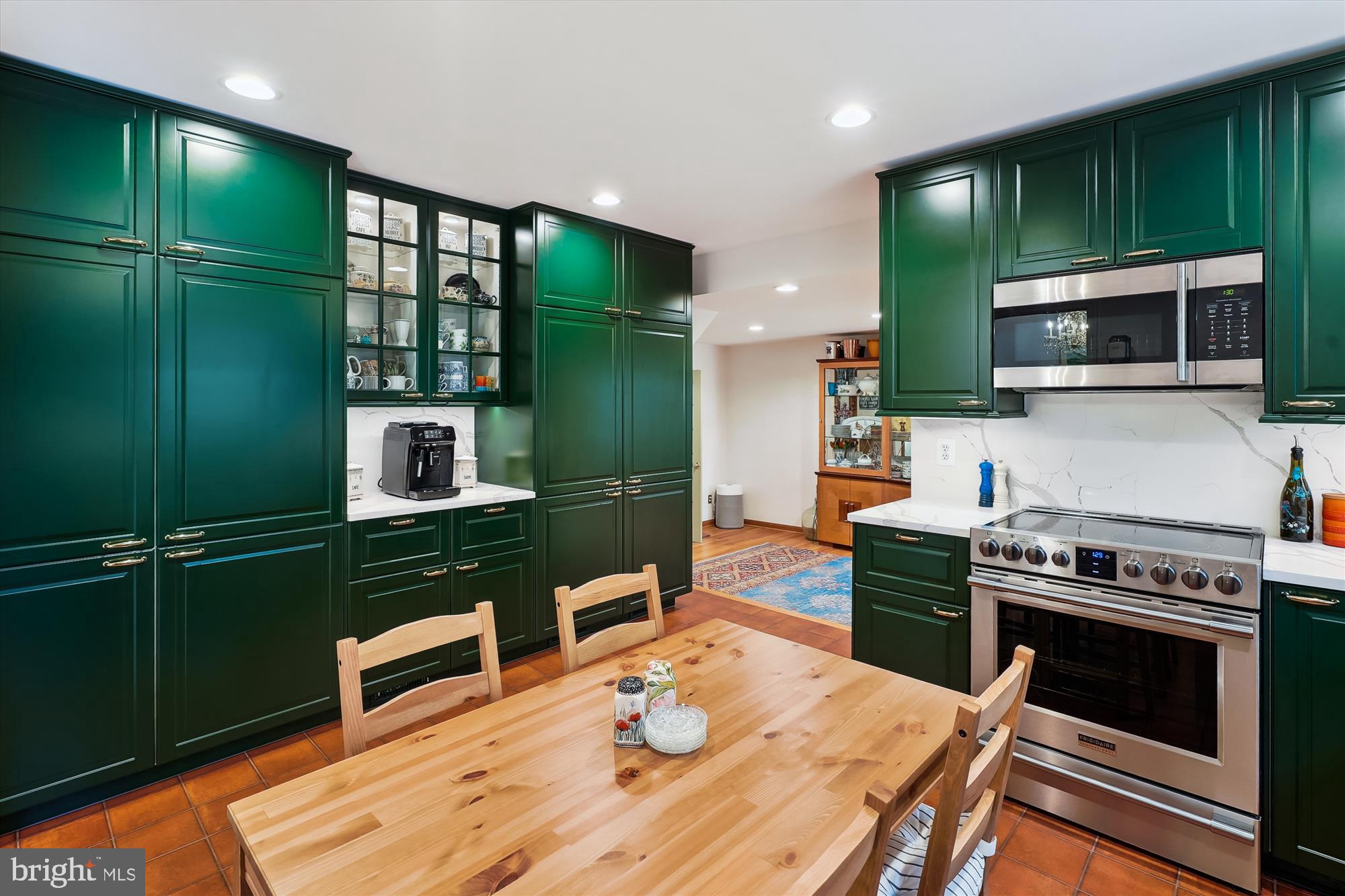 8510 Oakford Drive Springfield, VA 22152 - Photo 10 of 36 a kitchen with a stove and a microwave