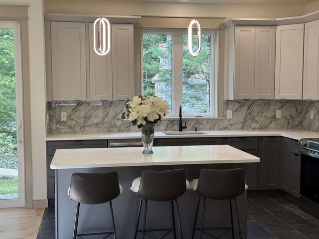 a kitchen with a table and chairs in it