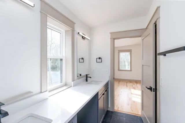 a spacious bathroom with a shower and a sink