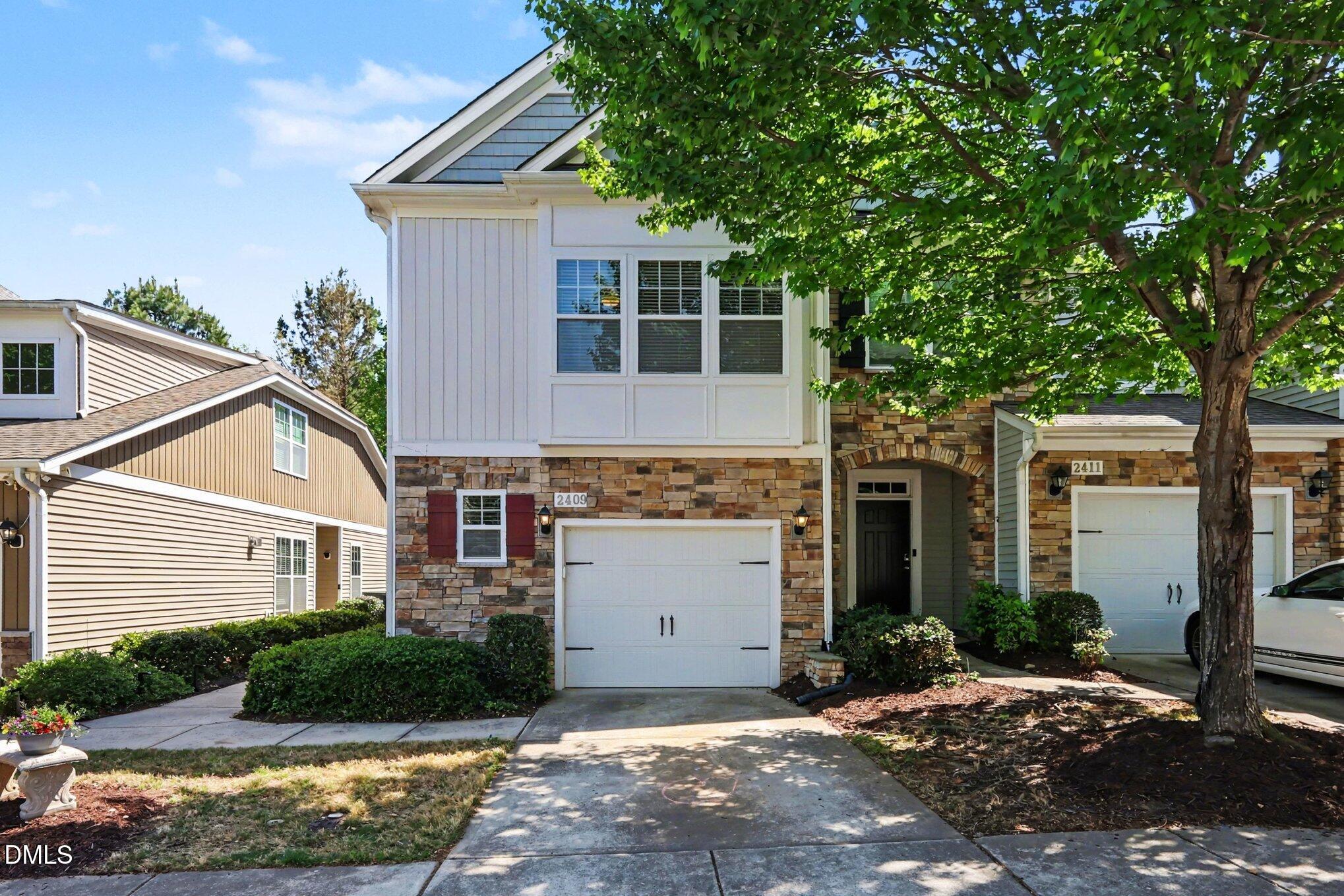 2409 Memory Ridge Drive Raleigh, NC 27606 - Photo 2 of 36 a view of a house with a yard