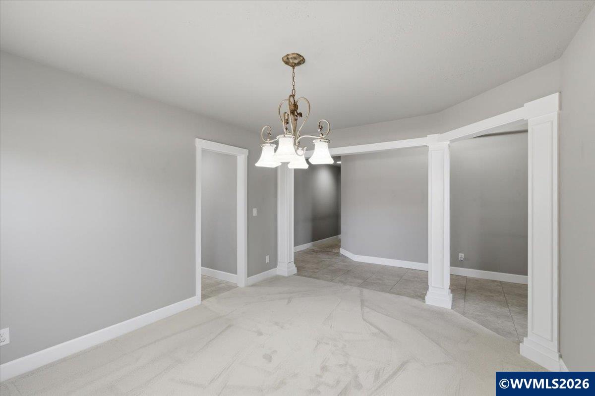 2359 Northwest Gale Street Albany, OR 97321 - Photo 8 of 47 a view of a chandelier in big room and chandelier