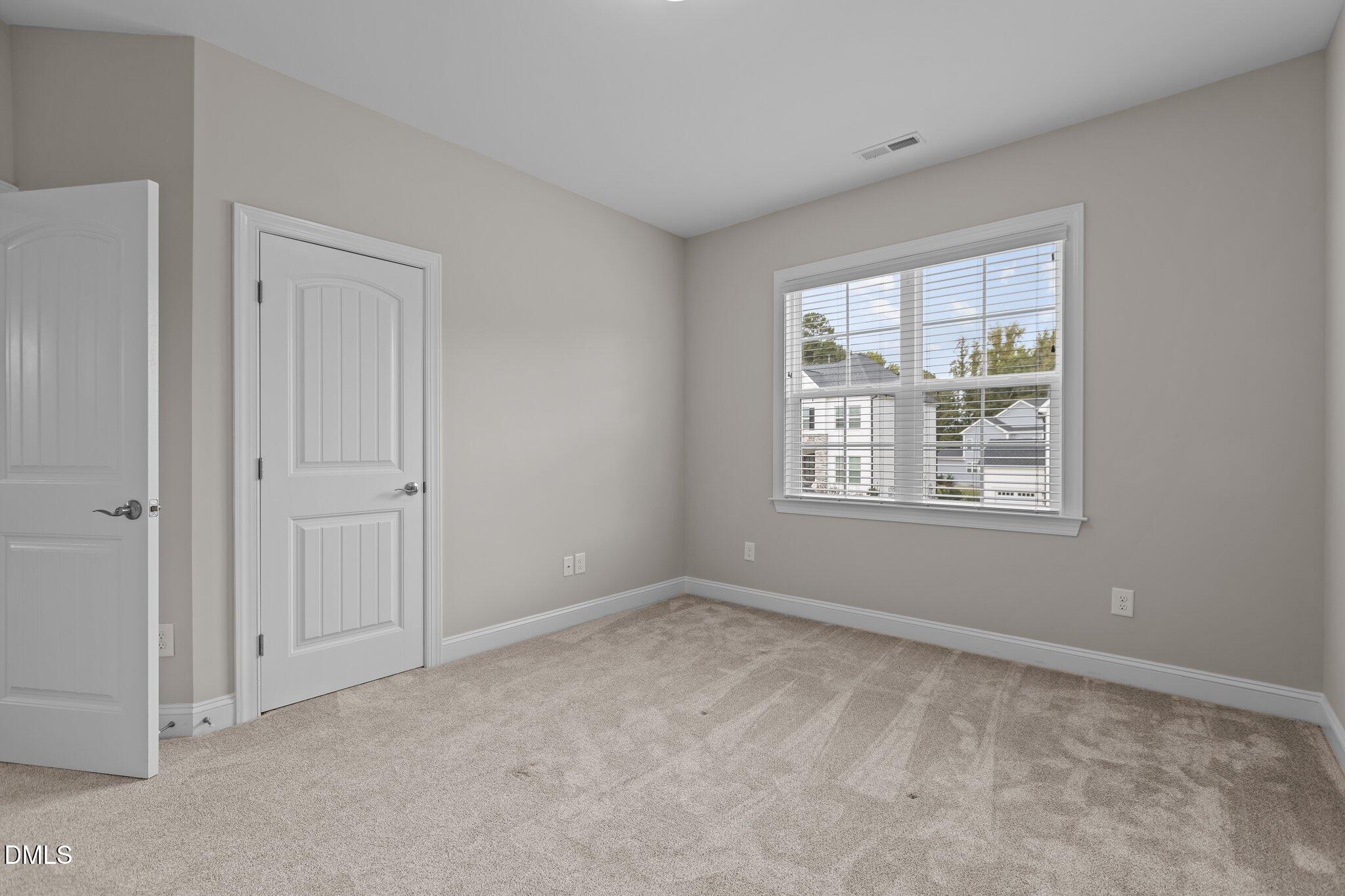 2923 Logan Valley Path Apex, NC 27502 - Photo 13 of 20 a view of an empty room with a window