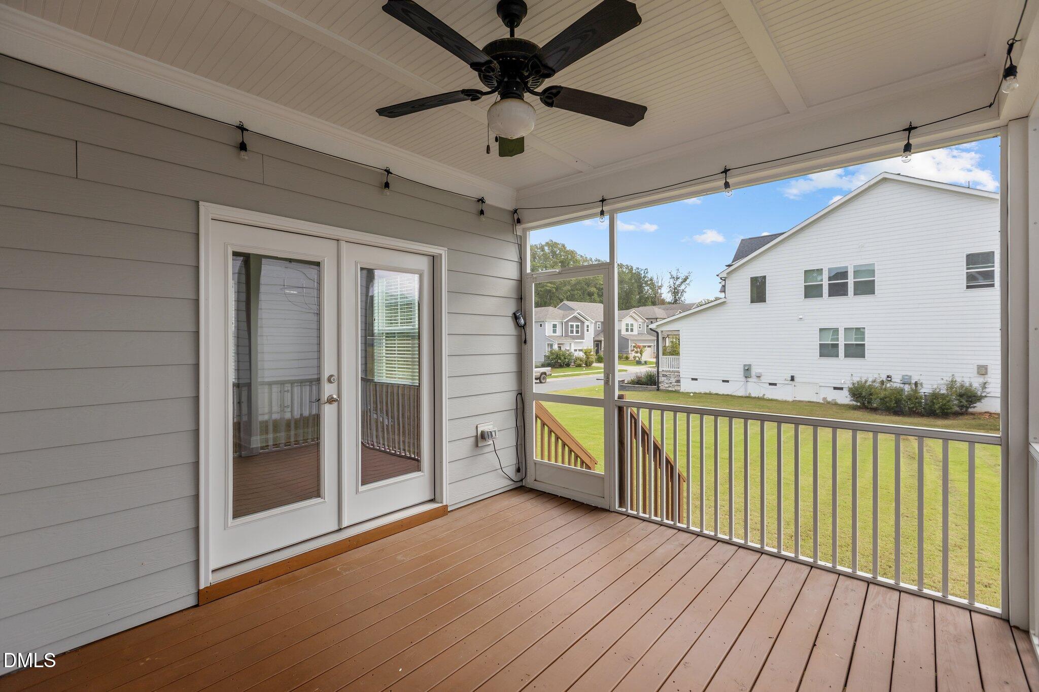 2923 Logan Valley Path Apex, NC 27502 - Photo 19 of 20 a view of a balcony with a ceiling fan