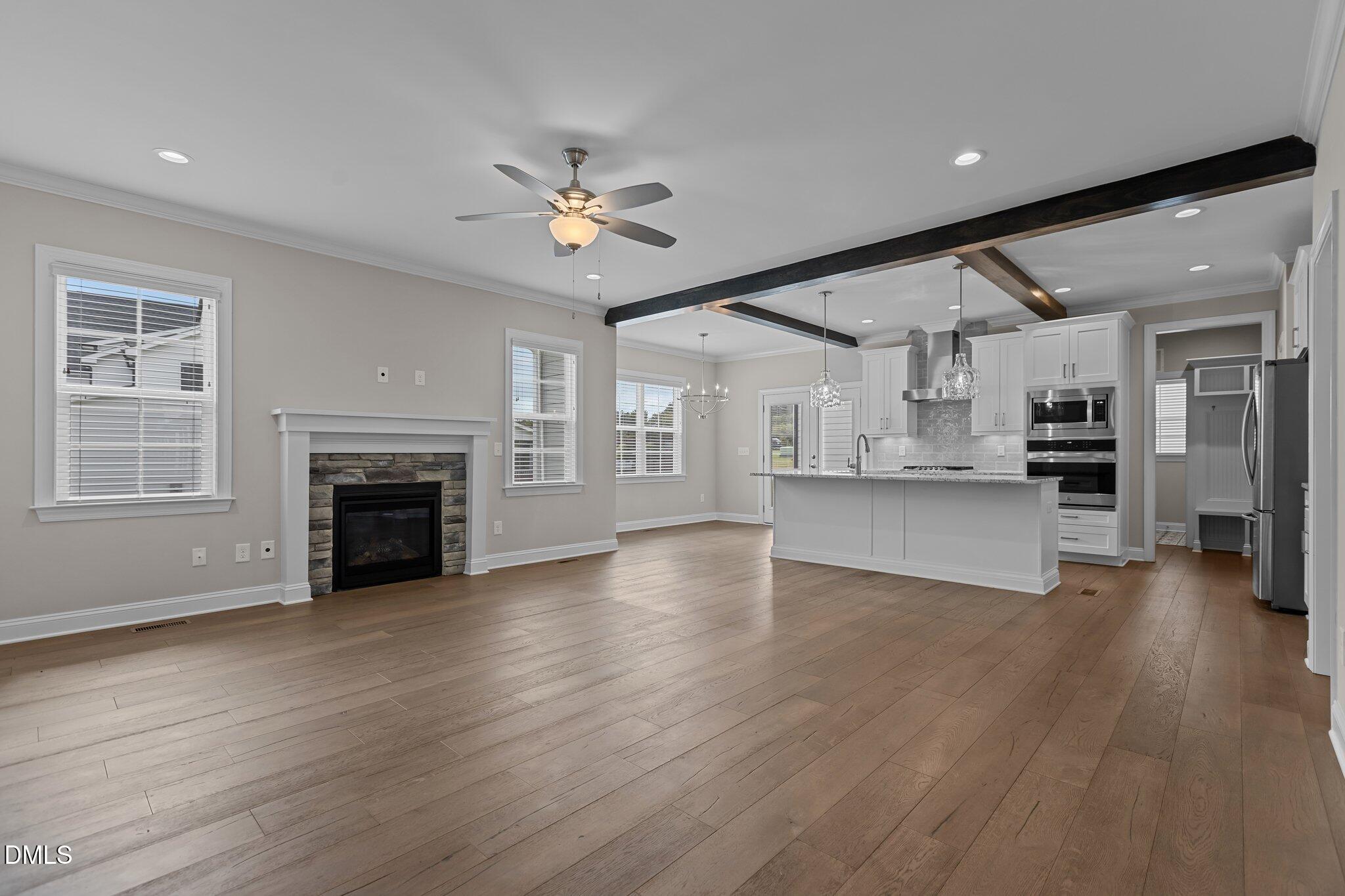 2923 Logan Valley Path Apex, NC 27502 - Photo 5 of 20 a view of an empty room with a kitchen and a kitchen