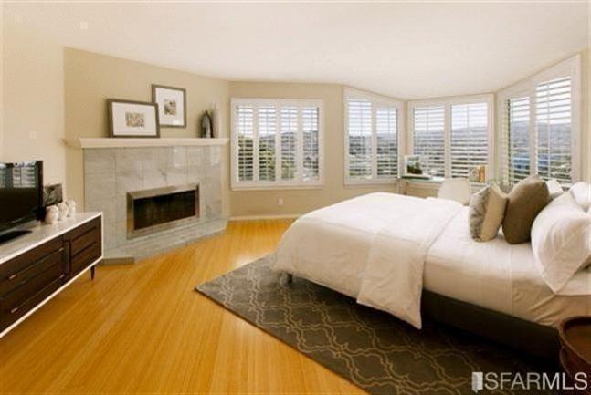 Enjoy the fireplace and sweeping views from Master Bedroom.  Tons of natural light!