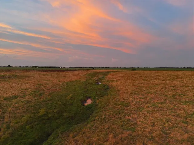 a view of an ocean and sunset