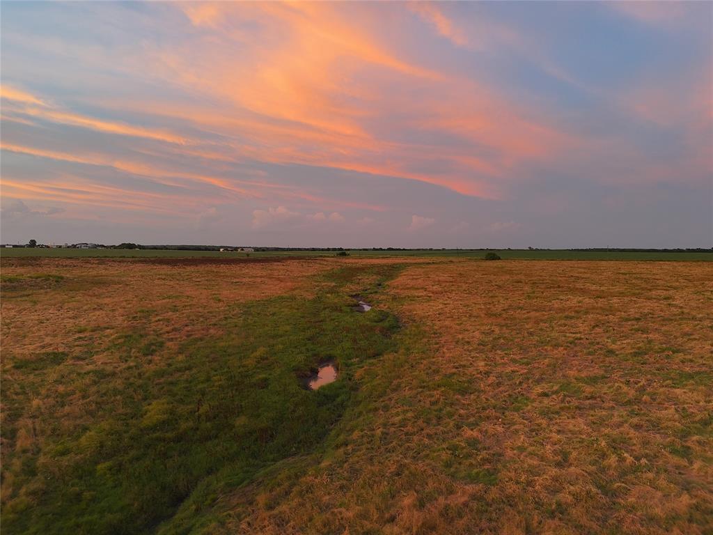 a view of an ocean and sunset