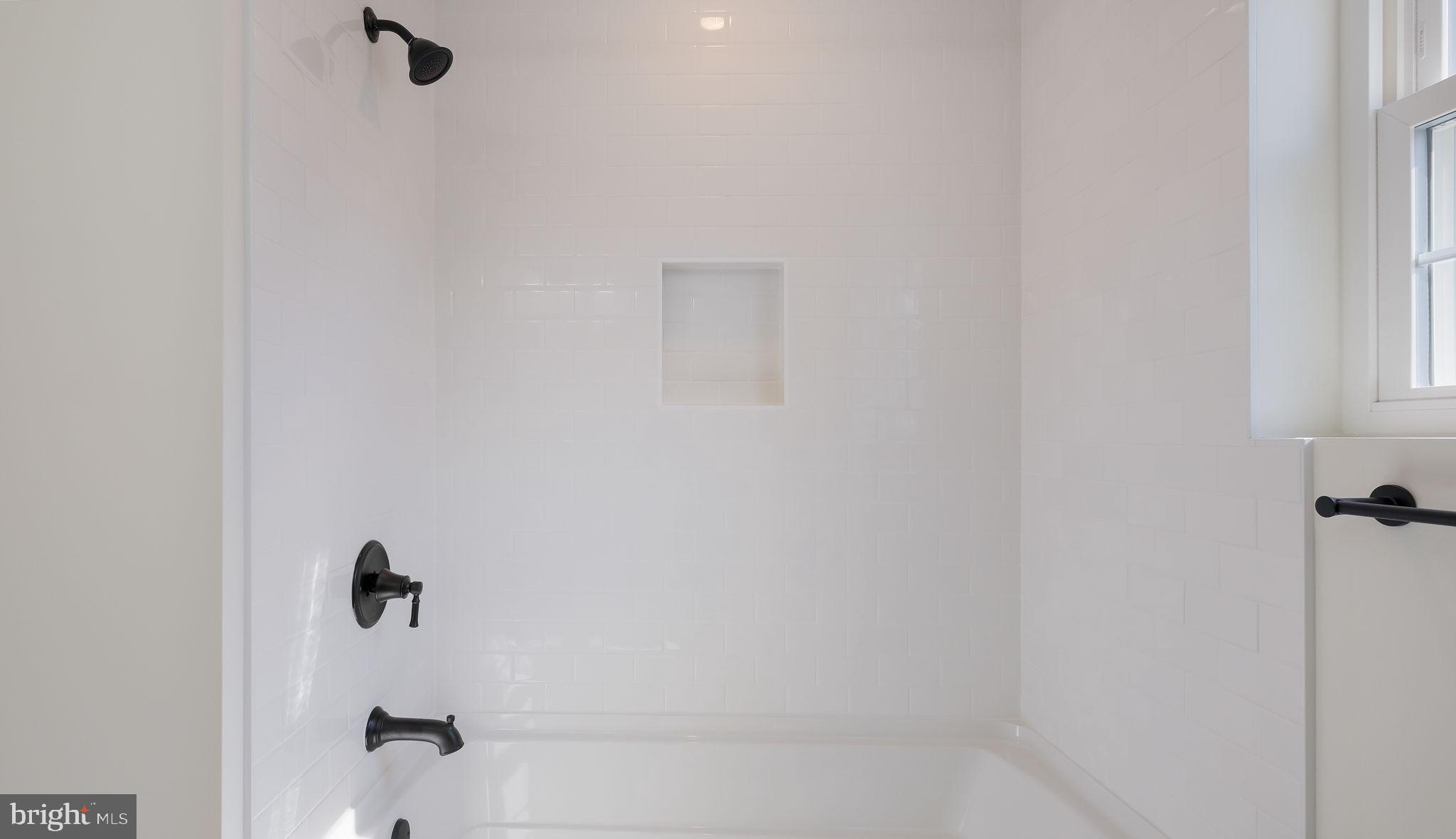108 Patterson Road Aston, PA 19014 - Photo 28 of 39 Tub shower with ceramic tile, hall bathroom