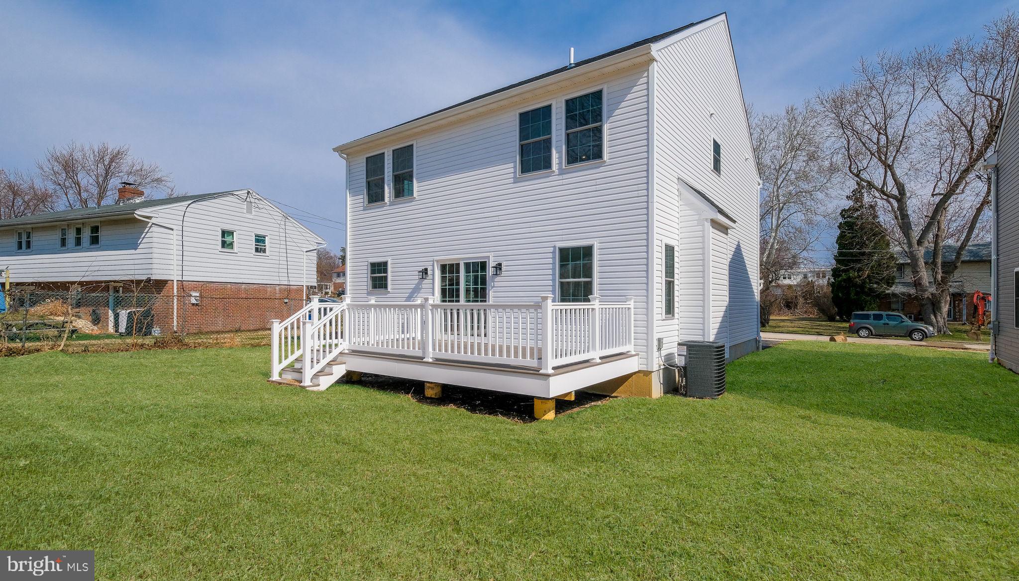108 Patterson Road Aston, PA 19014 - Photo 36 of 39 White vinyl siding and large deck