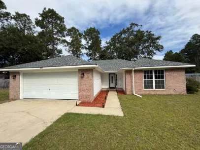 front view of a house with a yard
