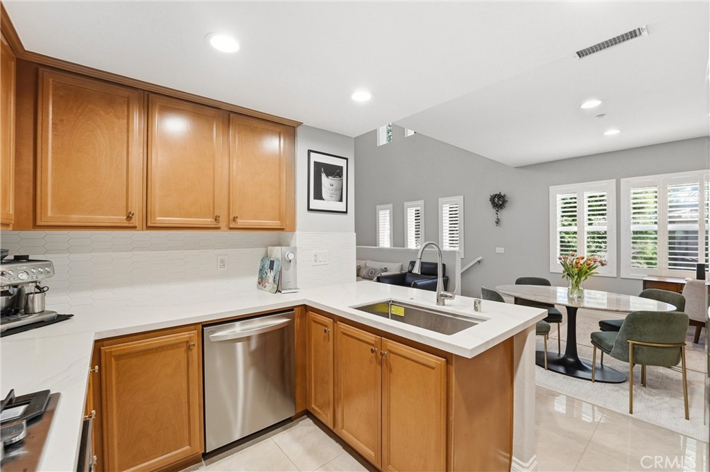143 Lockford Irvine, CA 92602 - Photo 12 of 43 a kitchen with a sink stove and cabinets