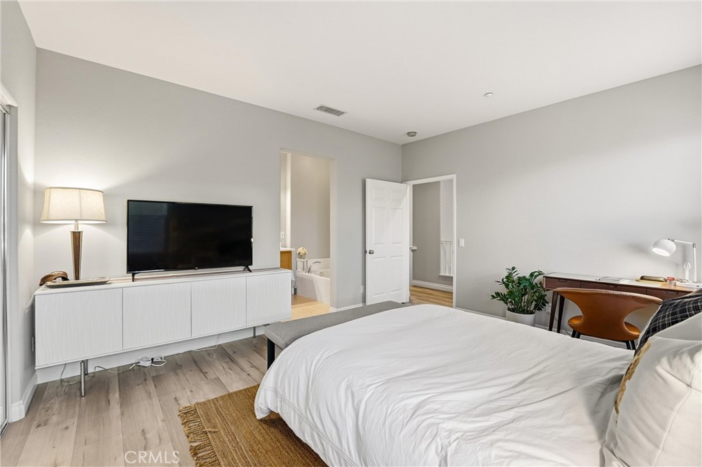143 Lockford Irvine, CA 92602 - Photo 23 of 43 a bedroom with a bed and a flat screen tv