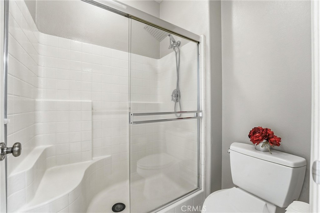 143 Lockford Irvine, CA 92602 - Photo 26 of 43 a bathroom with a toilet and a shower