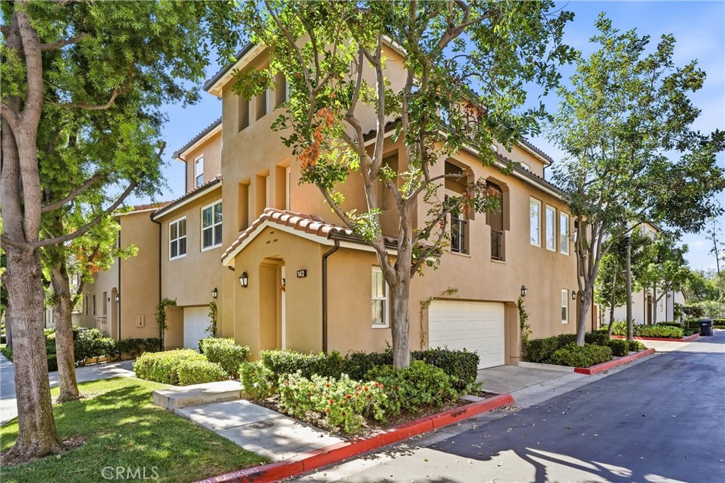 143 Lockford Irvine, CA 92602 - Photo 29 of 43 a front view of a multi story residential apartment buildings
