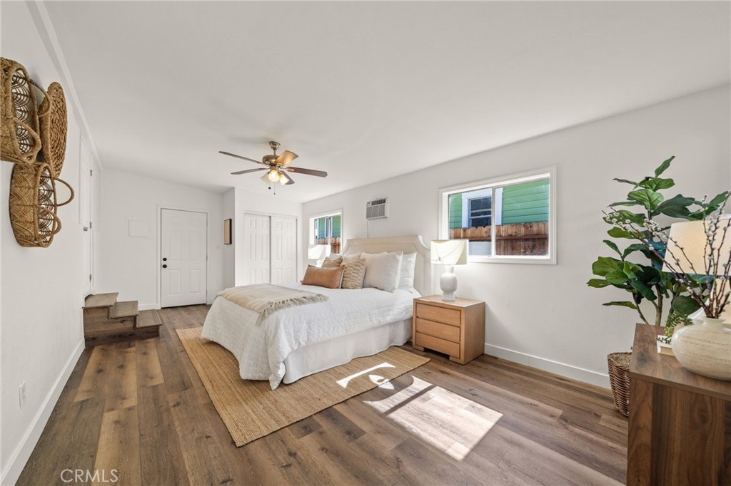 752 North Toledo Walk Long Beach, CA 90813 - Photo 15 of 32 a spacious bedroom with a bed lamp closet and a window
