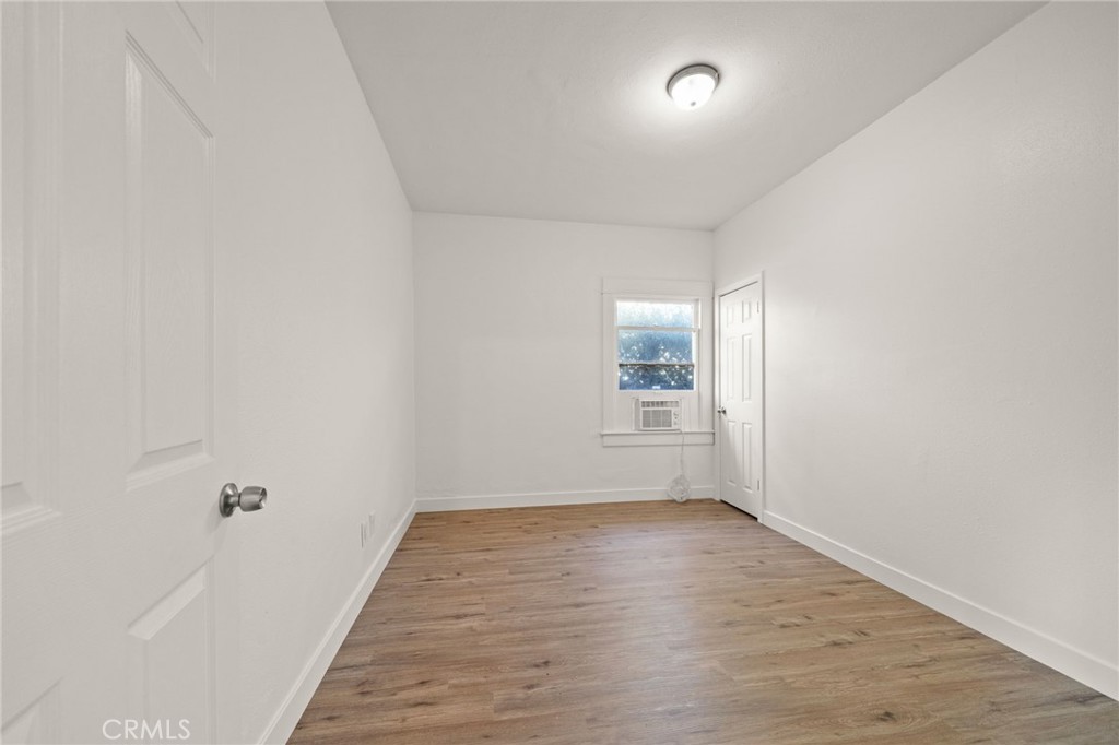 752 North Toledo Walk Long Beach, CA 90813 - Photo 21 of 32 an empty room with wooden floor and windows