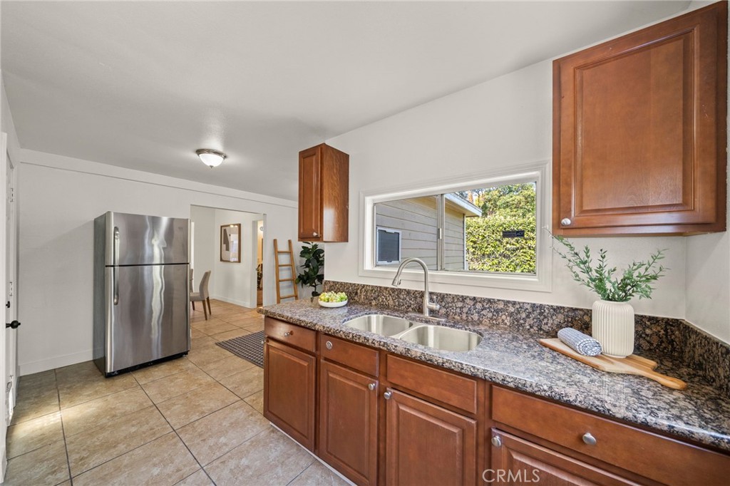 752 North Toledo Walk Long Beach, CA 90813 - Photo 10 of 32 a kitchen with granite countertop a sink a counter top space and stainless steel appliances