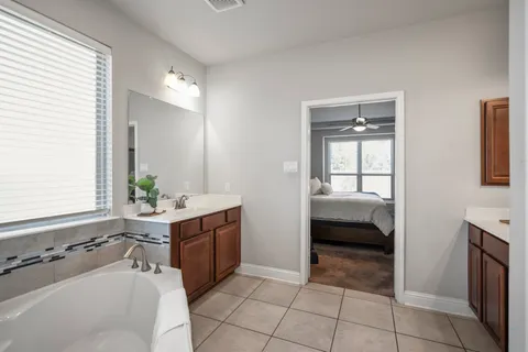a bathroom with a bathtub and a sink