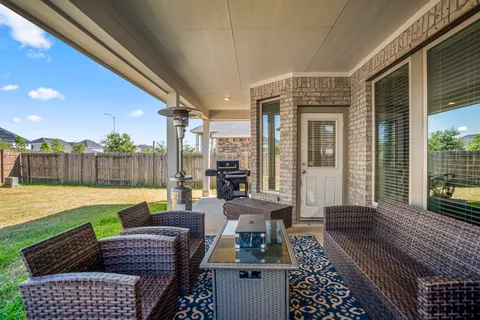 a view of swimming pool with outdoor seating