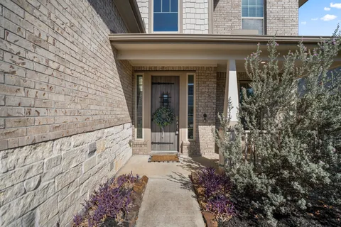 a front view of a house with a garage