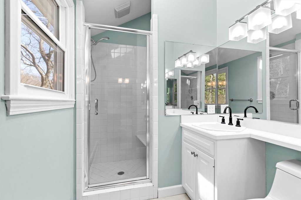 36 Cooke Road Plymouth, MA 02360 - Photo 20 of 37 a bathroom with a sink mirror and a shower