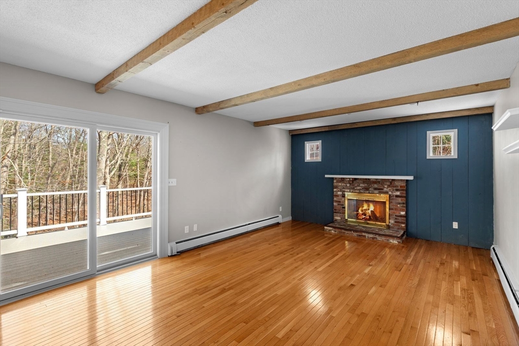 36 Cooke Road Plymouth, MA 02360 - Photo 8 of 37 a view of an empty room with a window and wooden floor