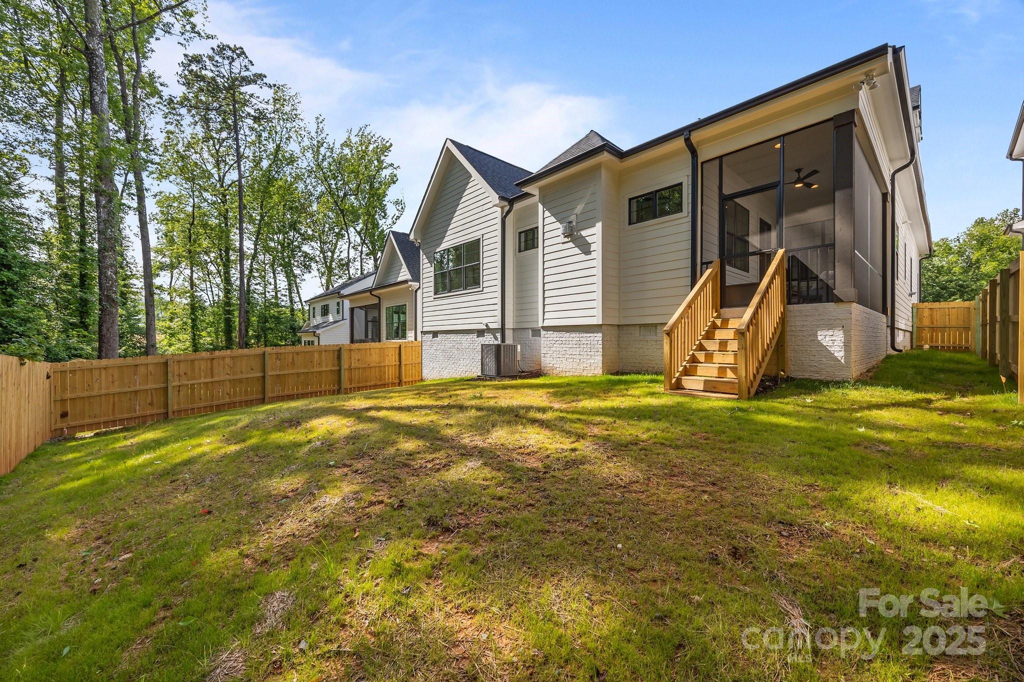 3945 Plainview Road Charlotte, NC 28208 - Photo 11 of 47 a view of a house with backyard and a tree