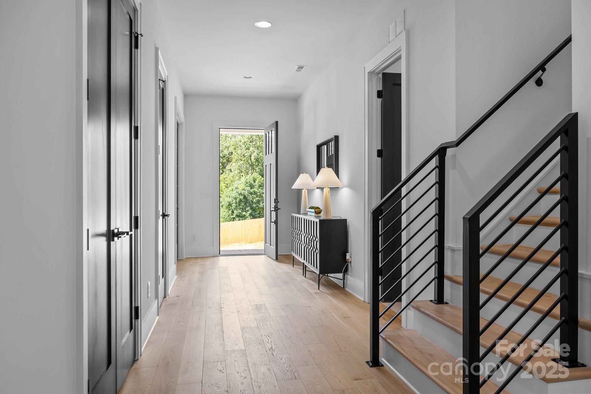 3945 Plainview Road Charlotte, NC 28208 - Photo 13 of 47 a view of entryway and hall with wooden floor