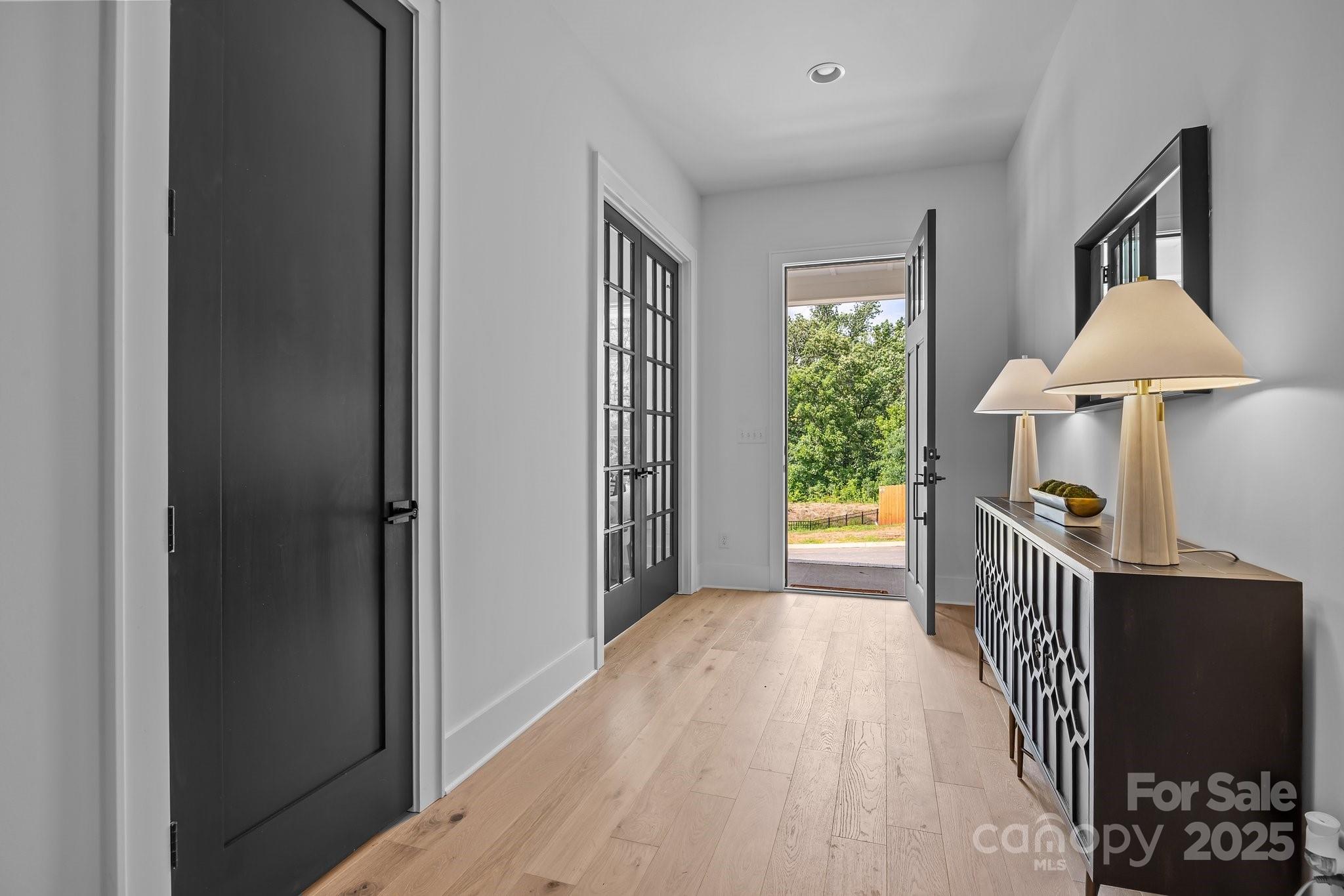 3945 Plainview Road Charlotte, NC 28208 - Photo 14 of 47 a view of hallway with furniture and a chandelier