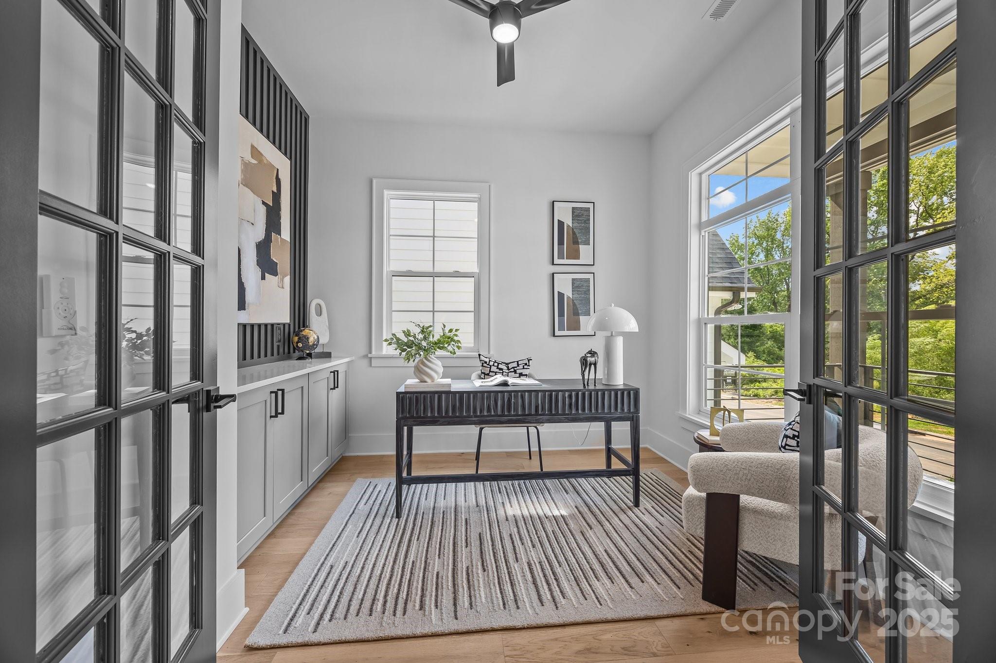 3945 Plainview Road Charlotte, NC 28208 - Photo 15 of 47 a living room with furniture a bed and large window