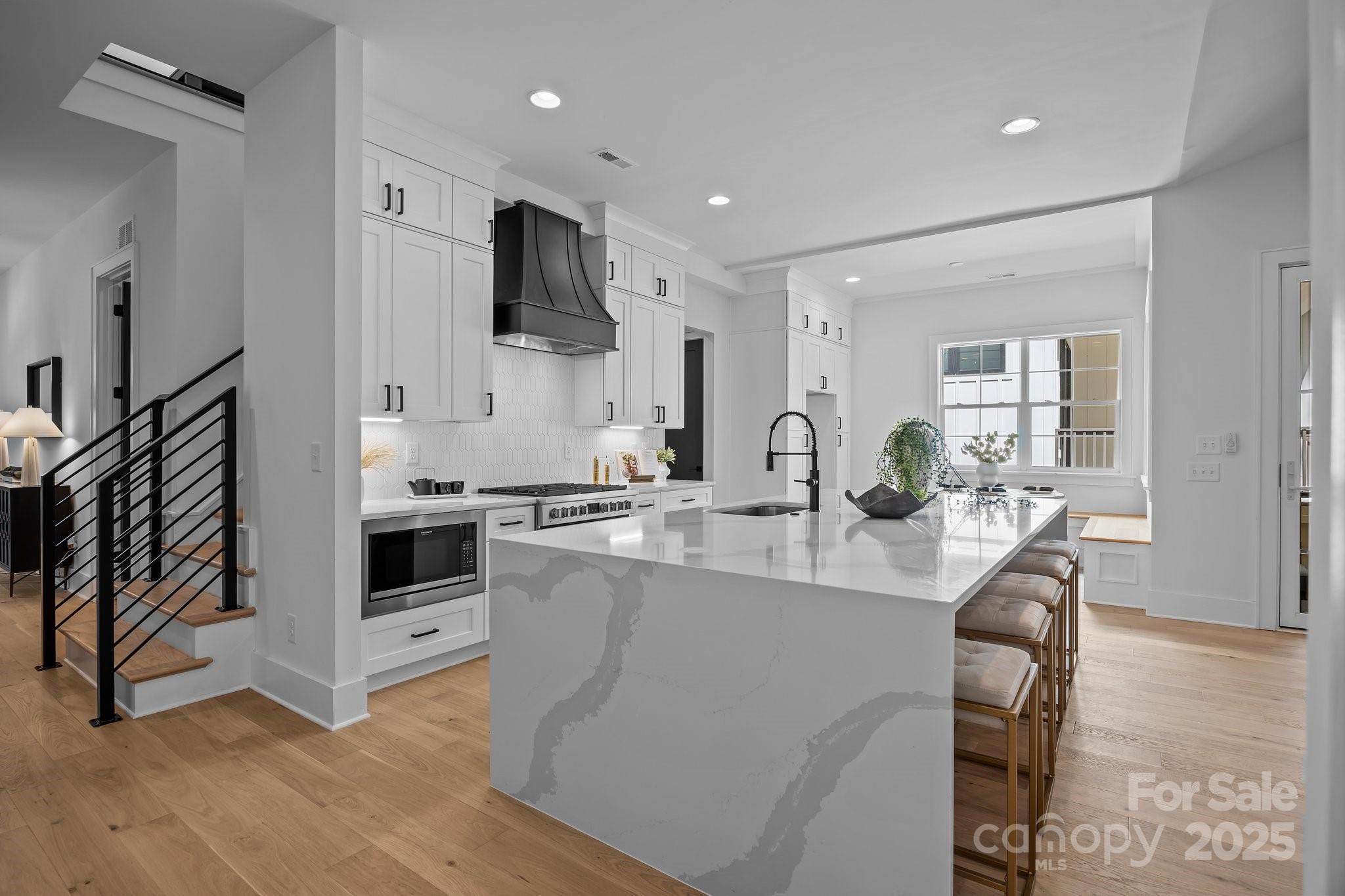 3945 Plainview Road Charlotte, NC 28208 - Photo 21 of 47 a large kitchen with stainless steel appliances granite countertop a stove refrigerator and a sink