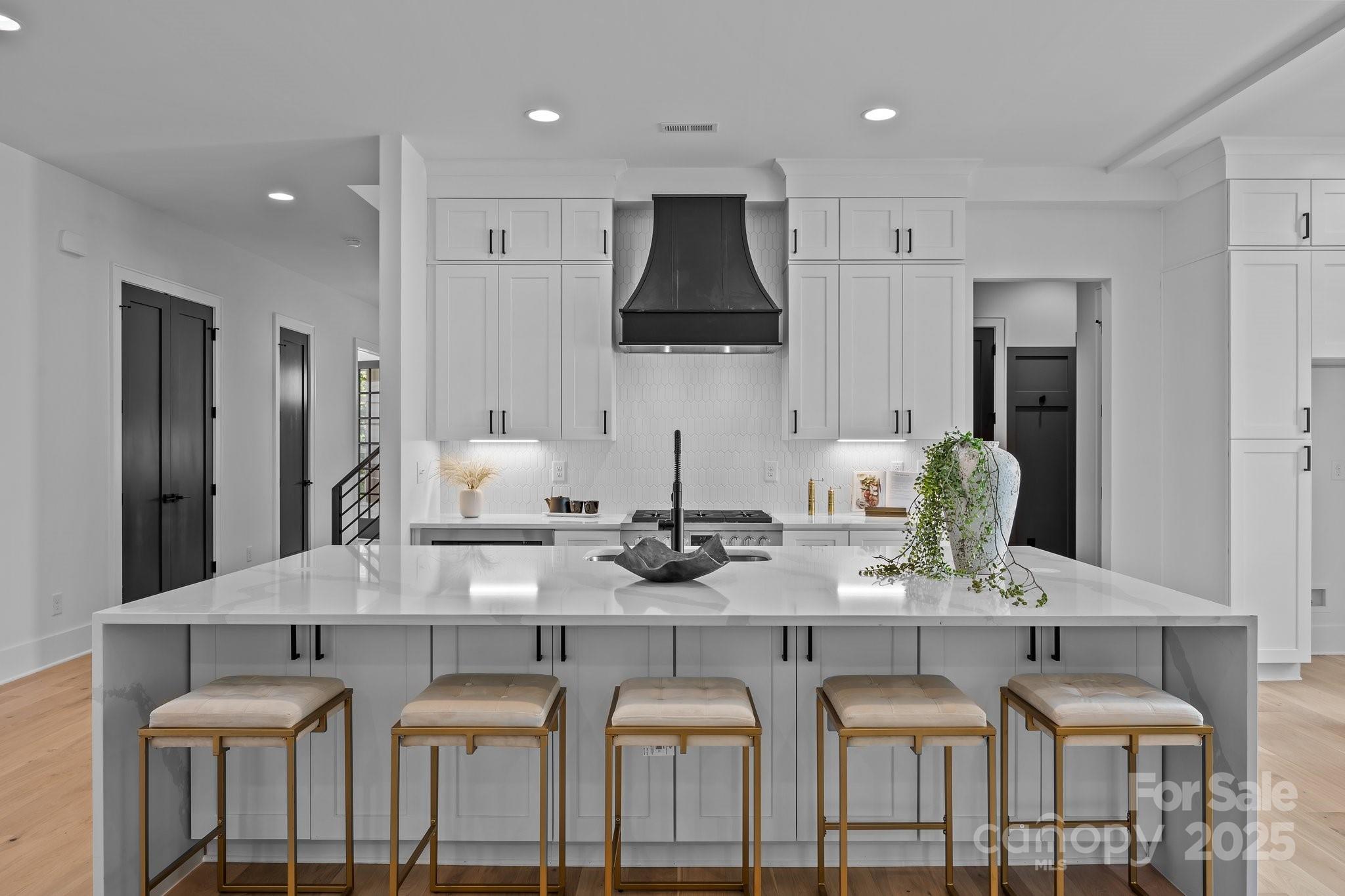 3945 Plainview Road Charlotte, NC 28208 - Photo 22 of 47 a kitchen with granite countertop a counter space chairs stainless steel appliances and cabinets