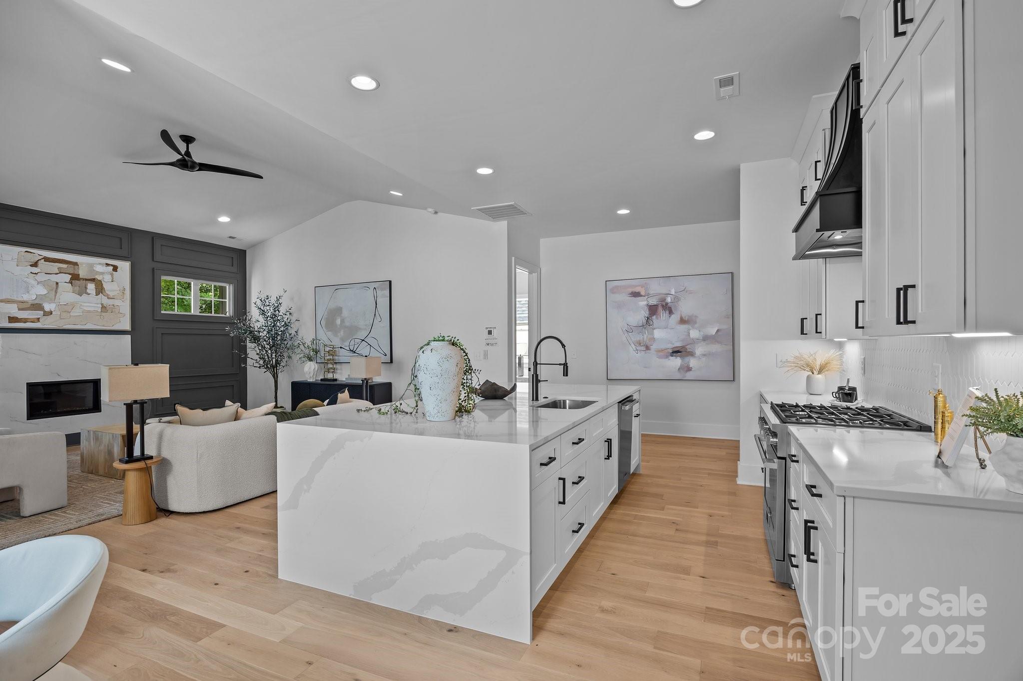 3945 Plainview Road Charlotte, NC 28208 - Photo 23 of 47 a large white kitchen with sink stove and cabinets