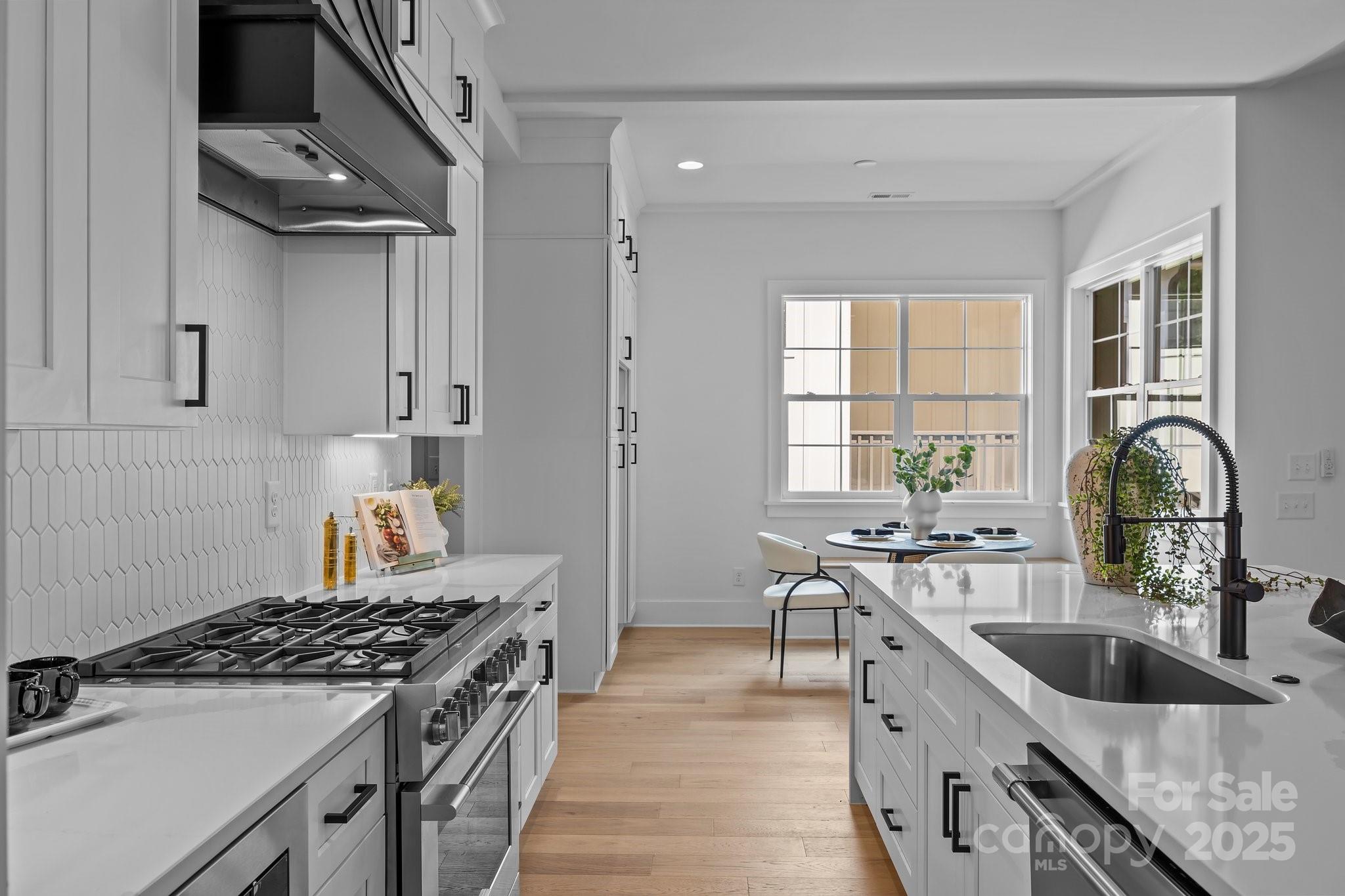 3945 Plainview Road Charlotte, NC 28208 - Photo 25 of 47 a kitchen with granite countertop a sink stove and refrigerator