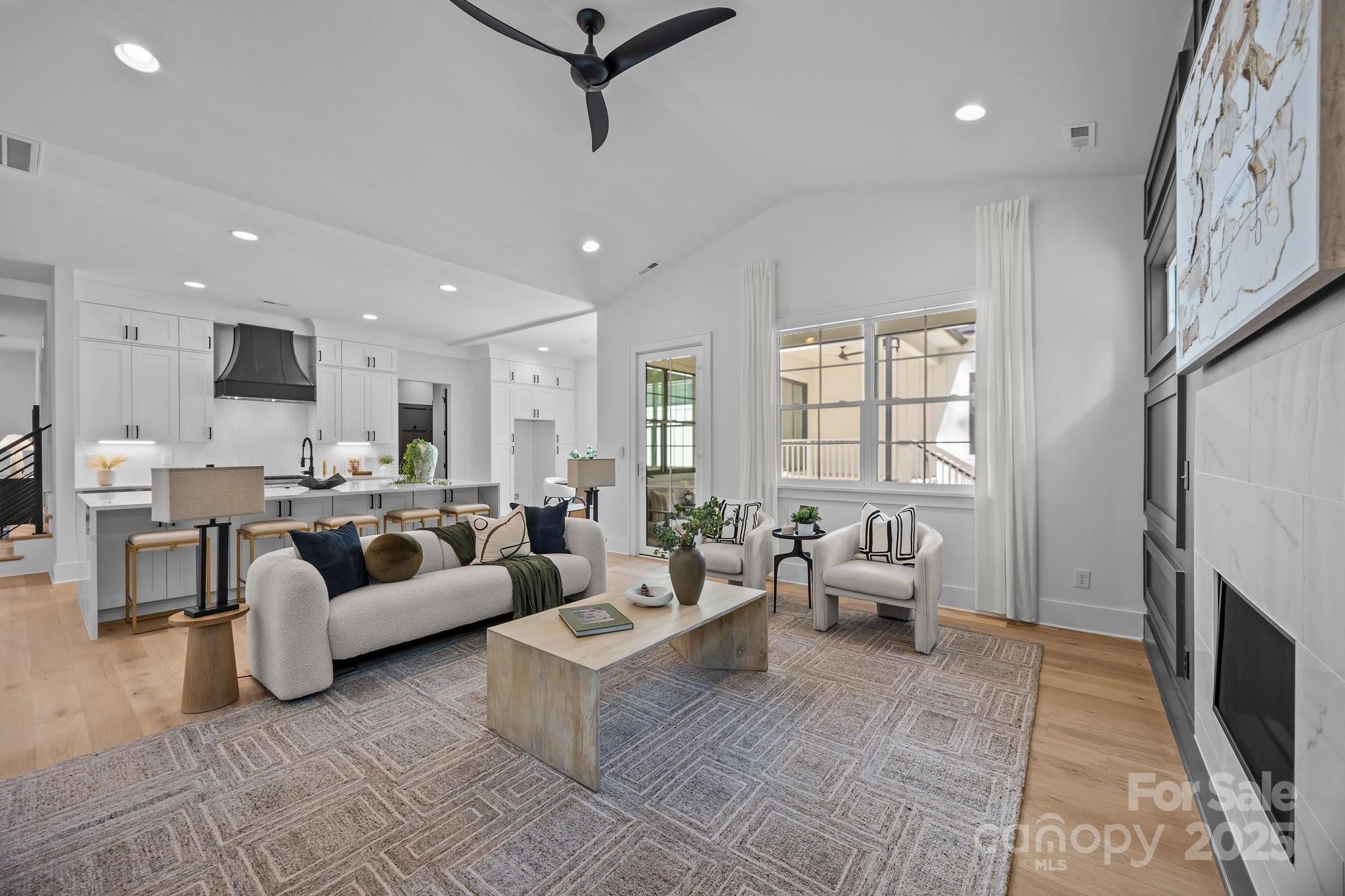 3945 Plainview Road Charlotte, NC 28208 - Photo 32 of 47 a living room with furniture and a fireplace