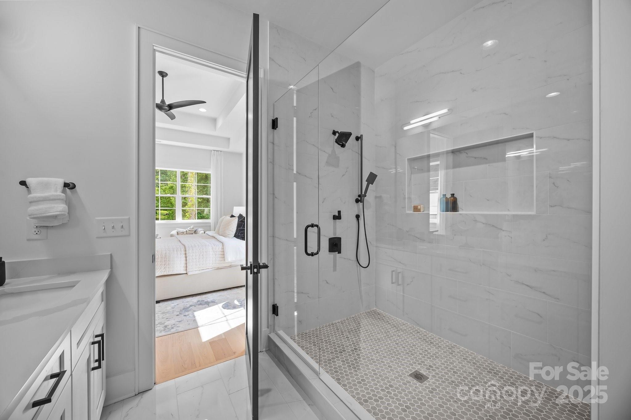 3945 Plainview Road Charlotte, NC 28208 - Photo 36 of 47 a bathroom with a tub shower sink and mirror