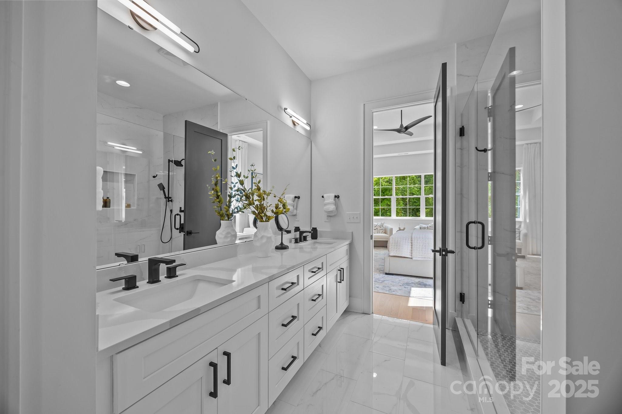 3945 Plainview Road Charlotte, NC 28208 - Photo 37 of 47 a bathroom with a double vanity sink mirror double and shower