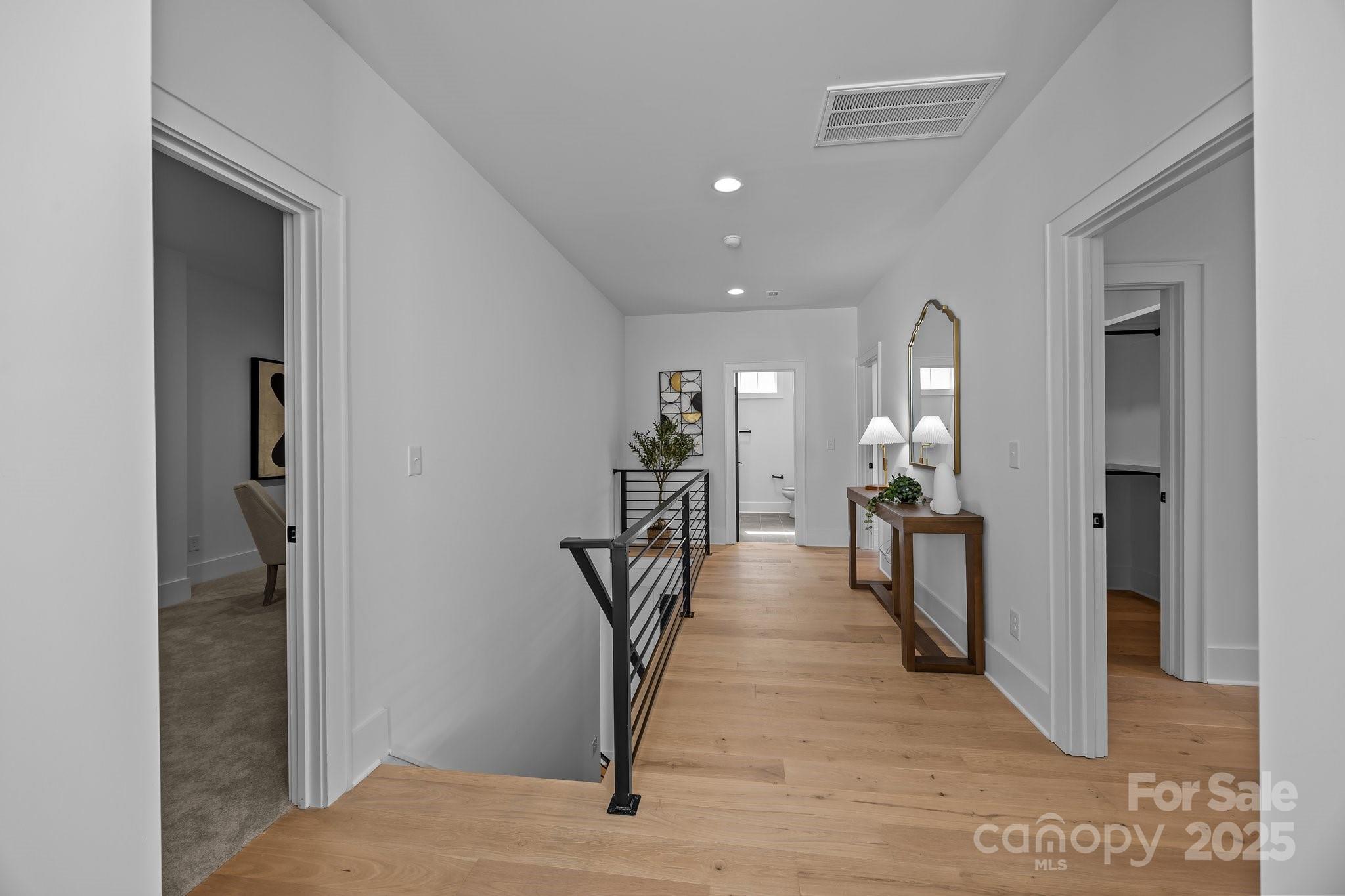 3945 Plainview Road Charlotte, NC 28208 - Photo 40 of 47 a view of a hallway with wooden floor and a living room