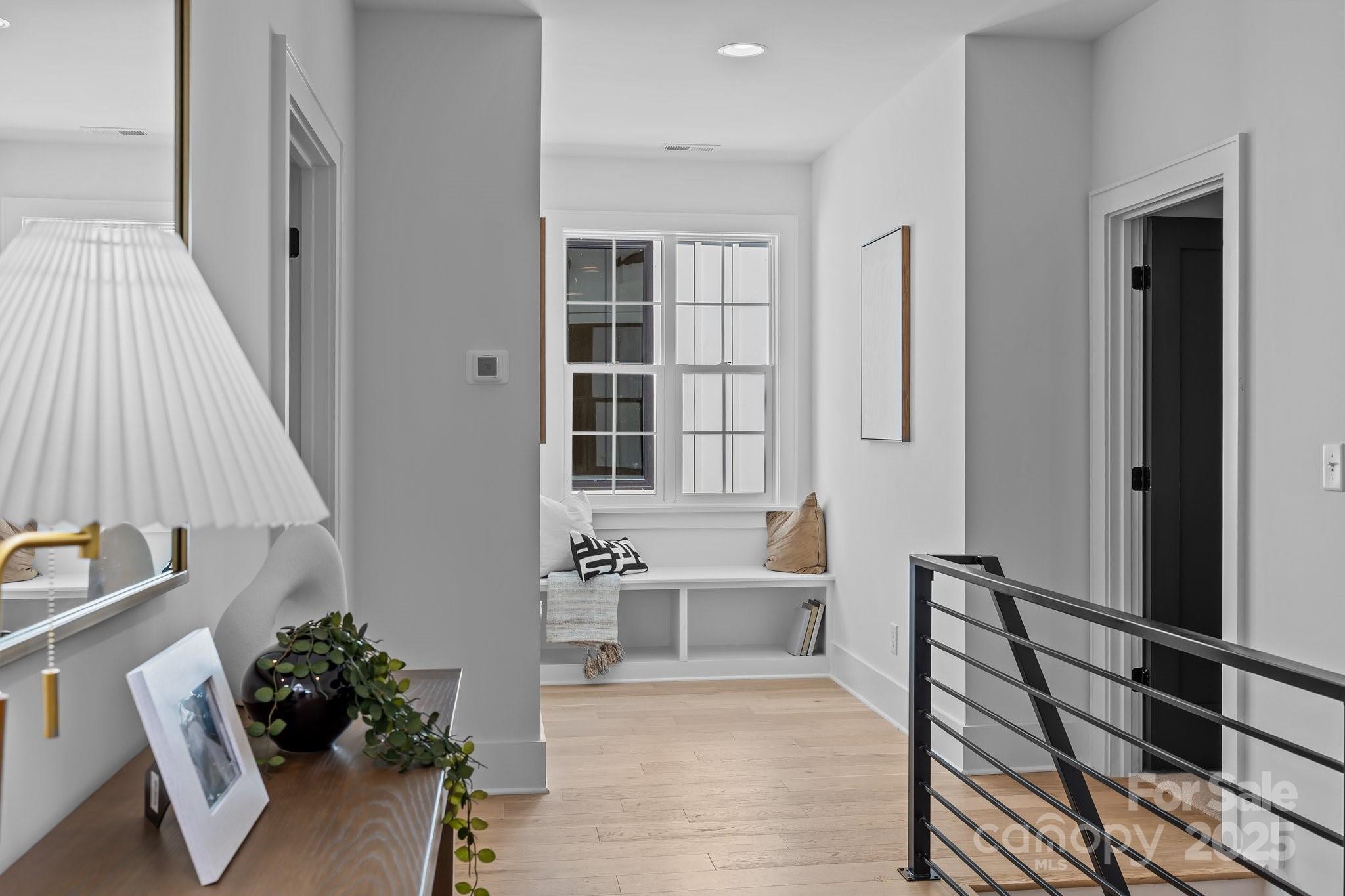 3945 Plainview Road Charlotte, NC 28208 - Photo 41 of 47 a living room with furniture and a lamp