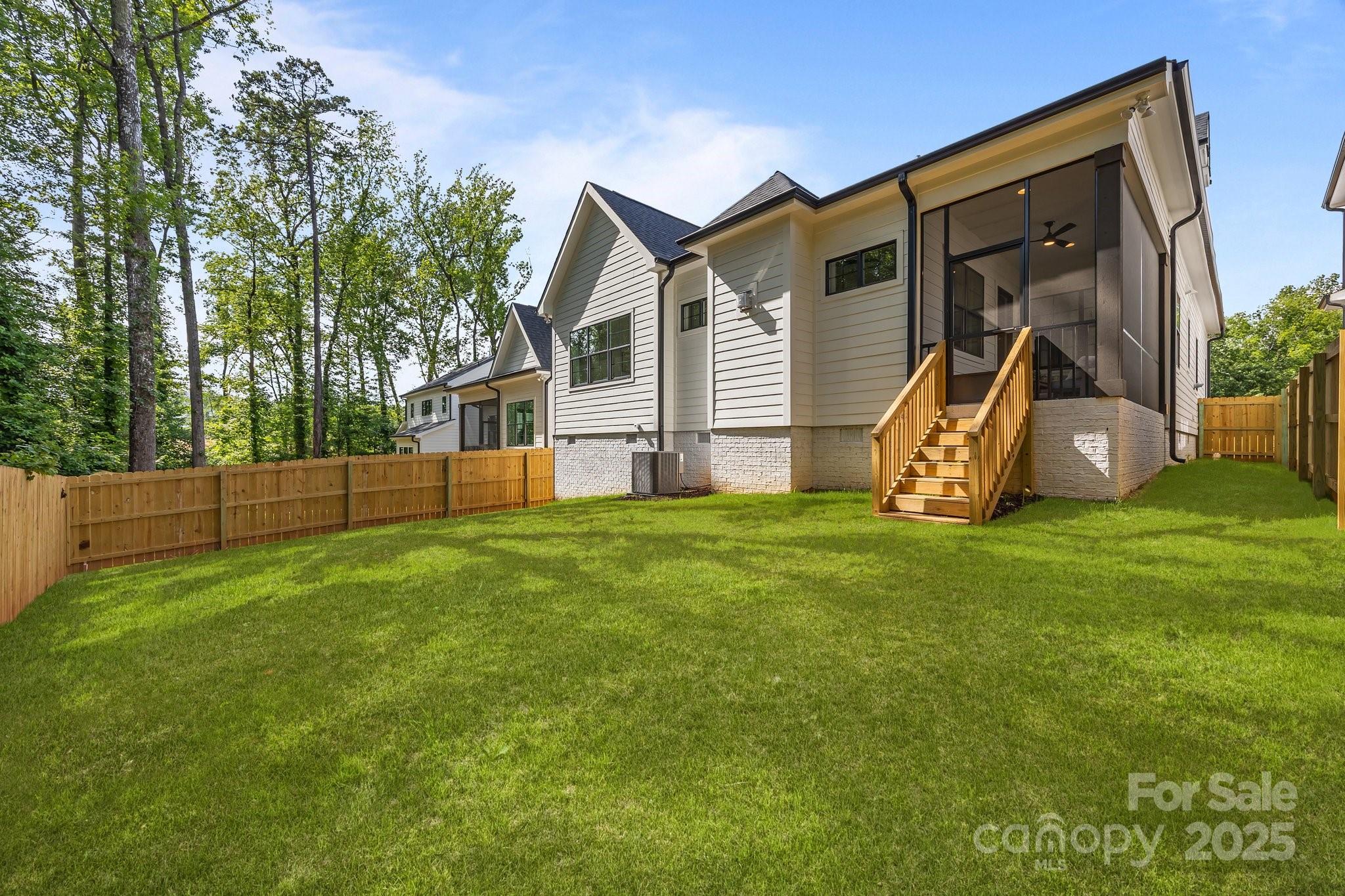 3945 Plainview Road Charlotte, NC 28208 - Photo 10 of 47 a view of a house with backyard and a slide