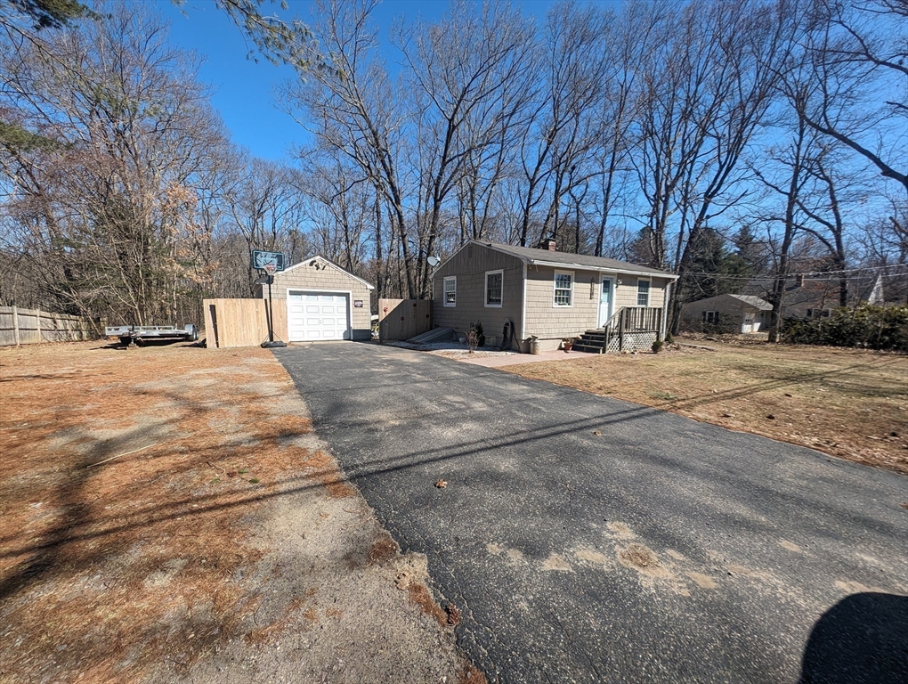 138 Old Worcester Road Charlton, MA 01507 - Photo 12 of 33 a white house that has a tree in front of it