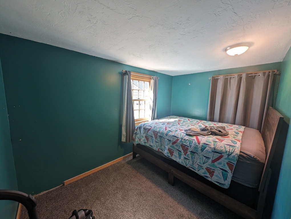 138 Old Worcester Road Charlton, MA 01507 - Photo 15 of 33 a bedroom with a bed and a window