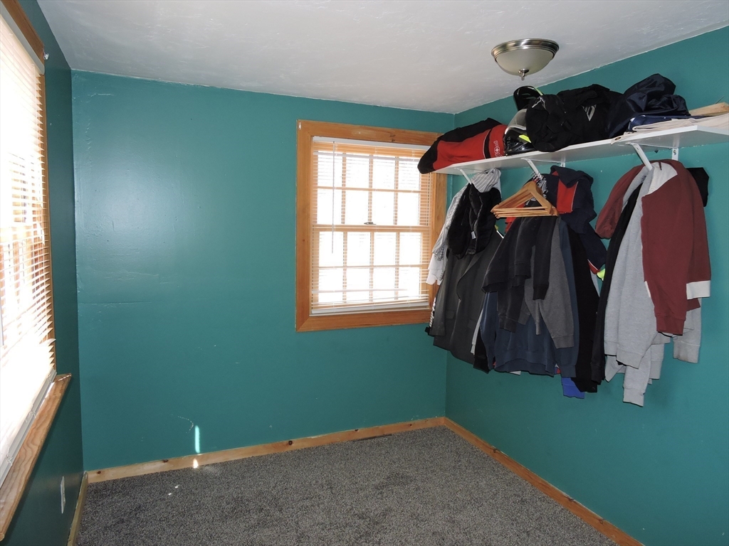 138 Old Worcester Road Charlton, MA 01507 - Photo 17 of 33 a view of walk in closet with clothes and shoes