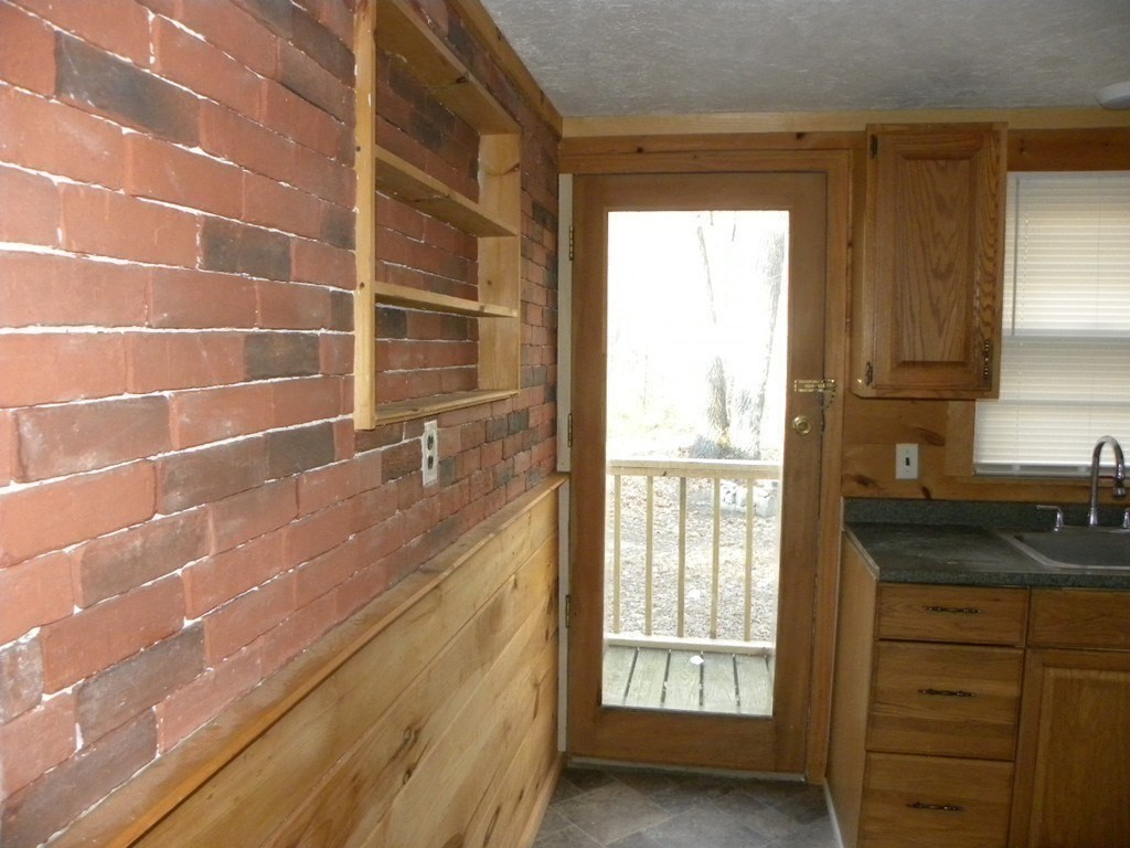 138 Old Worcester Road Charlton, MA 01507 - Photo 20 of 33 a bathroom with a granite countertop sink a mirror and next to a window