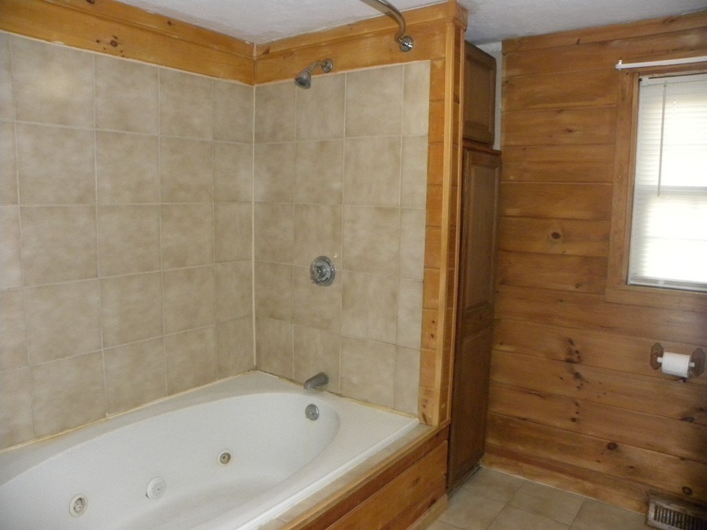138 Old Worcester Road Charlton, MA 01507 - Photo 24 of 33 a bathroom with a bathtub and a shower