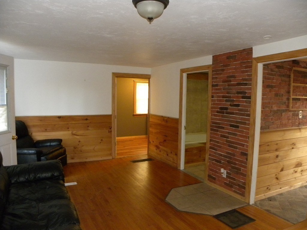 138 Old Worcester Road Charlton, MA 01507 - Photo 4 of 33 a view of a livingroom with furniture and wooden floor