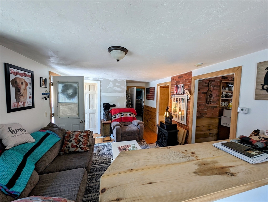 138 Old Worcester Road Charlton, MA 01507 - Photo 7 of 33 a bedroom with bed and wooden floor