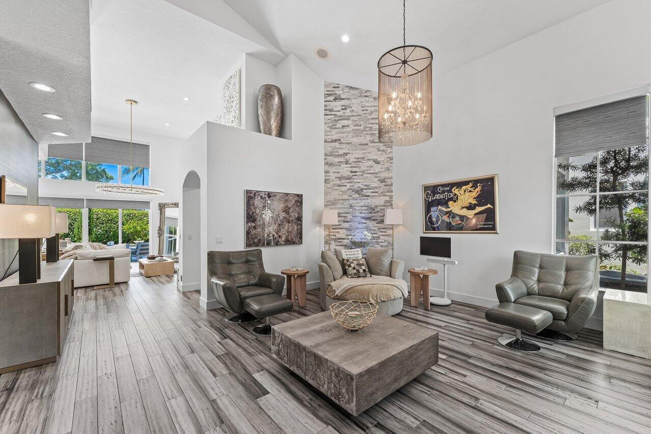 3395 Northwest 53rd Circle Boca Raton, FL 33496 - Photo 3 of 64 a living room with furniture and a wooden floor
