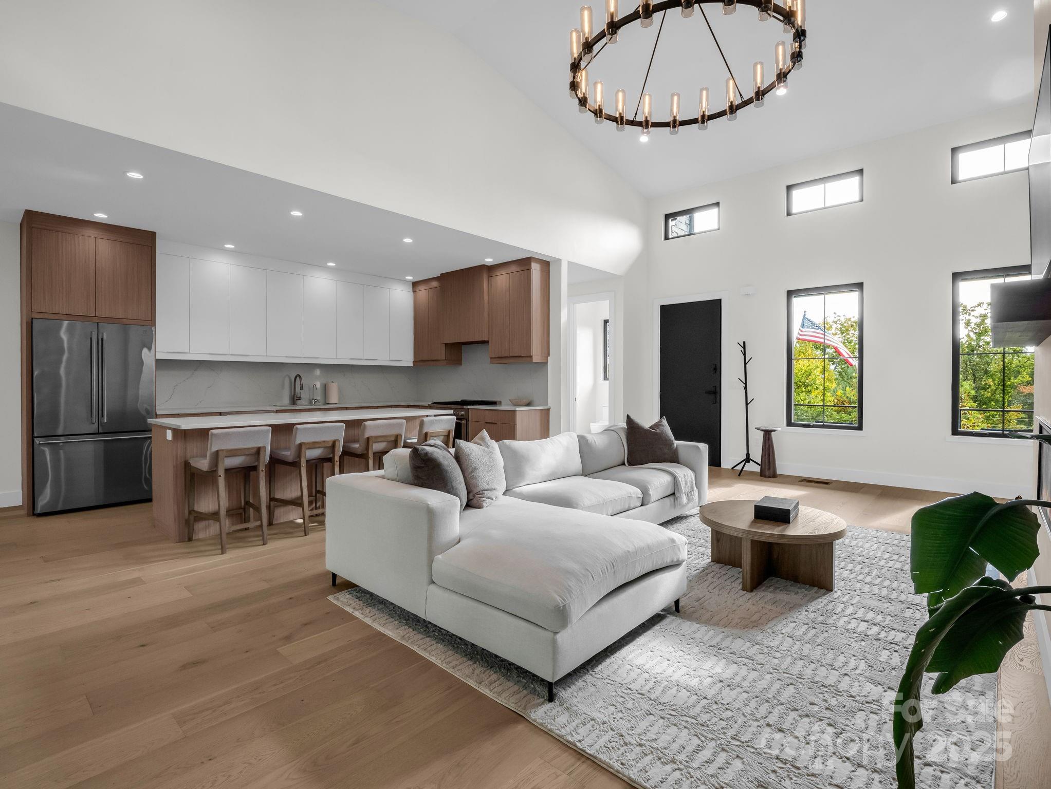123 Millbrae Loop Hendersonville, NC 28791 - Photo 17 of 48 a living room with furniture a dining table and kitchen view